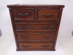 An antique mahogany apprentice chest.
