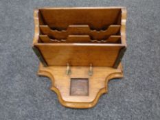 An Edwardian oak letter and pen rack.