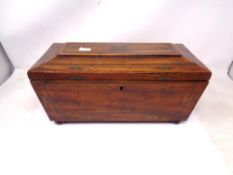 A Regency brass inlaid mahogany tea caddy.