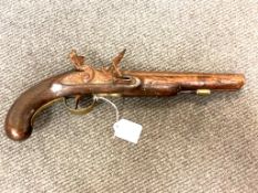 An ornamental flintlock pistol