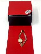 A lady's Tissot 9ct gold cased wrist watch with metal bracelet