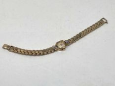 A lady's Bulova wrist watch with rolled gold case and bracelet