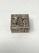 A small silver pill box