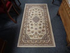 A small modern Persian design run on cream ground.