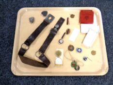 A girl guide's belt together with enameled badges, medal on ribbon etc.