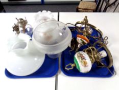 Two brass framed and ceramic ceiling lights together with two further glass paraffin lamp