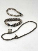 Two white metal bracelets and a necklace