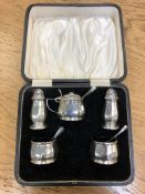 A silver five-piece condiment set,