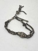 A vintage silver bracelet with tassel