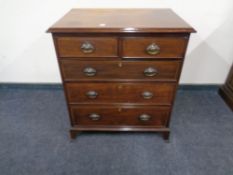 An inlaid mahogany five drawer chest.