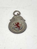 A silver disc pendant