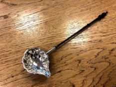 A George III silver toddy ladle, John Muns, London 1767, length 31.
