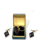 A yellow gold smokey quartz ring and a pair of matching earrings