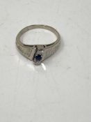 An 18ct gold diamond and sapphire ring