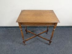 An Edwardian oak occasional table.
