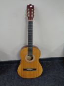 An Encore acoustic guitar.