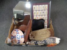 A box containing miscellanea including an octagonal frameless bevel-edged mirror,