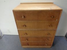 A 20th century oak five drawer chest