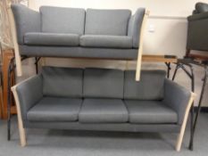 A late 20th century continental three seater settee in grey upholstery with matching two seater