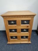 A small pine three drawer chest