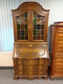 A continental beech stained glass door bureau book case