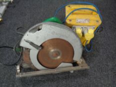 A 110-volt transformer together with a powersaw