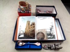 A small leather bound album of modern postcards together with a Fossil wristwatch,