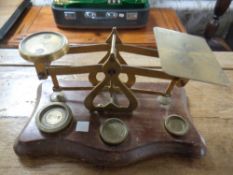 An antique set of postal scales with brass weights