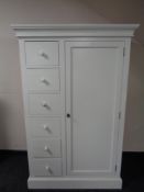 A contemporary white painted wardrobe fitted with six drawers