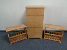 A contemporary oak effect chest with a pair of magazine racks