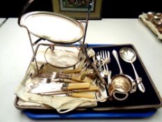 A tray of boxed EPNS salad servers and unboxed stainless steel,