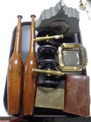 A tray containing two ornamental cannons on stands, a pair of juggling clubs, a slate barometer,