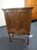 A continental oak two door cabinet