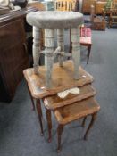 A beech nest of three tables together with a rustic stool