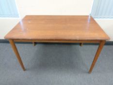 A 20th century teak rectangular dining table