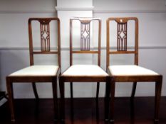 A set of three inlaid dining chairs