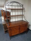 A contemporary beech and metal dresser with fitted cupboards and drawers beneath