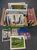 A box containing a collection of oil on boards by T.