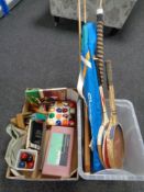 Two boxes containing tennis rackets,