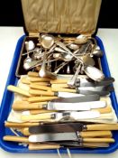 A tray of boxed and unboxed stainless steel and EPNS flatware