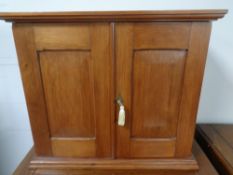 An Edwardian pine double door countertop cabinet with fitted internal shelves and drawers