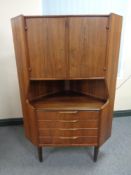 A 20th century continental teak cocktail corner cabinet