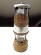 A British coal mining brass and chrome miner's lamp