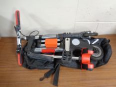 A folding mini-bike in carry bag