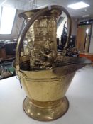 A brass coal bucket and a brass stick stand