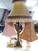 A brass and onyx table lamp with two others