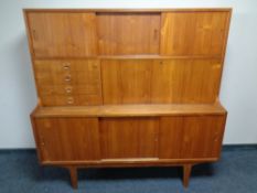 A 20th century teak sliding door sideboard