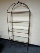 A contemporary metal framed set of glass shelves