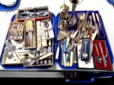 Two trays containing plated and stainless steel cutlery (boxed and unboxed), plated teapot,