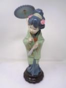 A Lladro figure - Geisha with parasol.